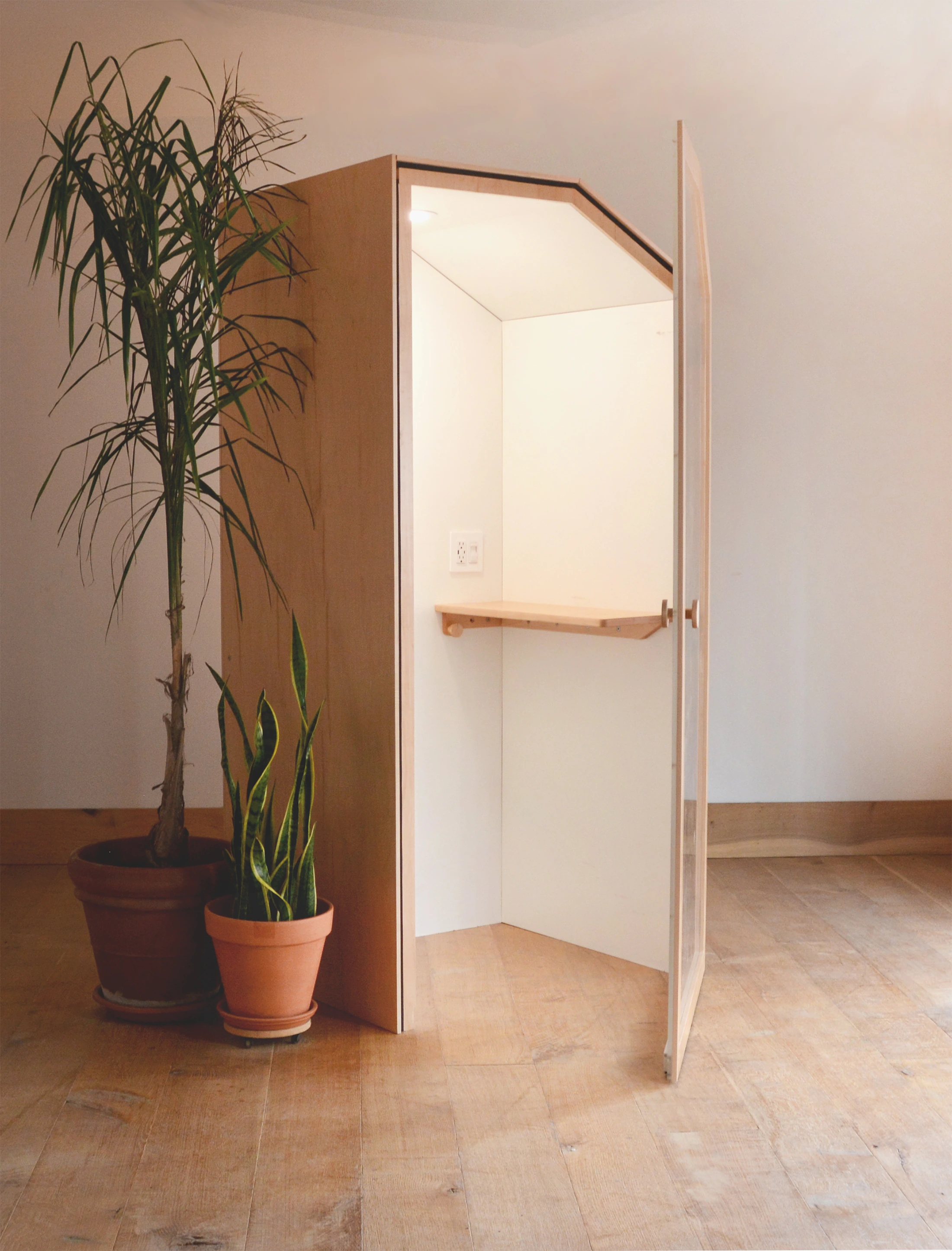 A person using an OpenBooth for a phone call